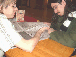 Sean and Matt Reading the Carletonian, the newspaper of Carleton College, while in Burton Hall, the larger of the two dormitory cafeterias on campus.