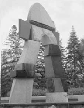  The arch before the library constructed in the 1970s by the internationally famous Greek artist Dmitri Hadzi, known for stacking rocks on top of each other.  See his website at http://www.hadzi.com/ 